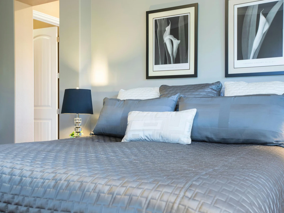 Close-up of double bed in freshly painted bedroom by Barnstaple Decorators