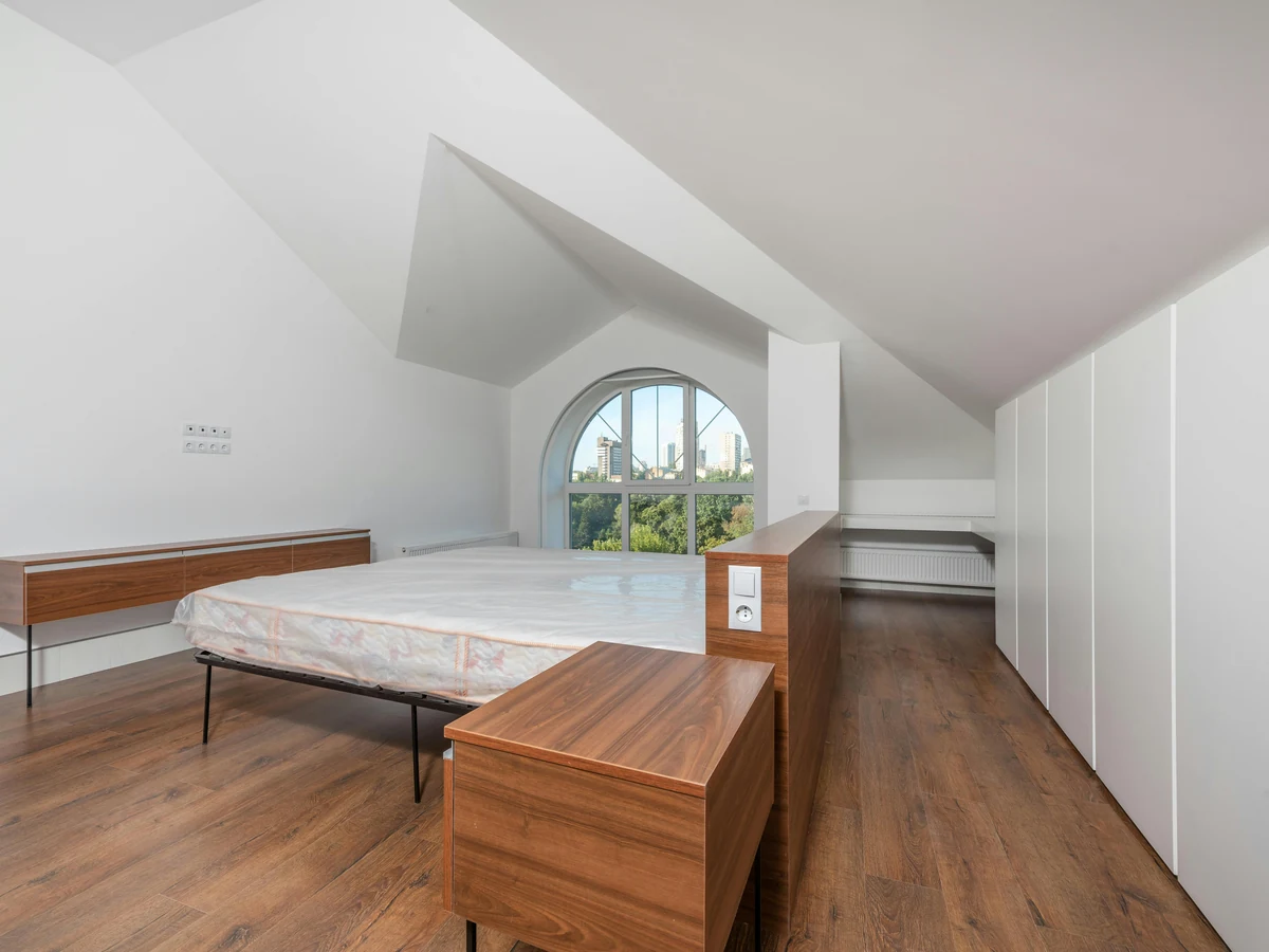 Minimalist loft bedroom freshly painted by Barnstaple Decorators