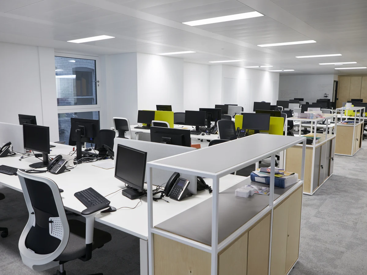 Empty open plan office space prepared for commercial painting by Barnstaple Decorators