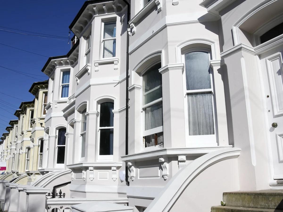 Row of white Georgian properties with freshly painted exterior masonry in Barnstaple