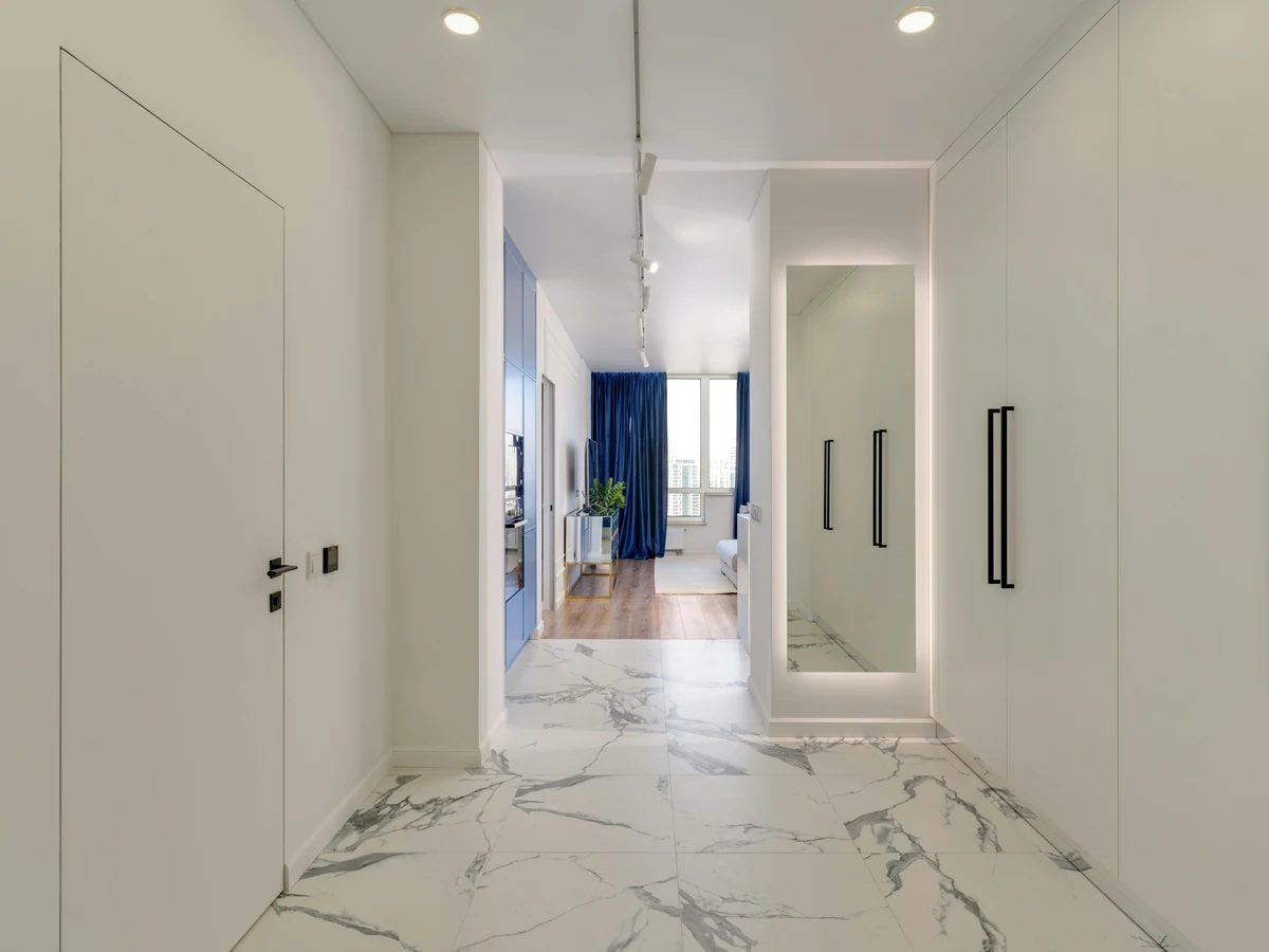 Minimalist white hallway with marble flooring freshly painted in Barnstaple