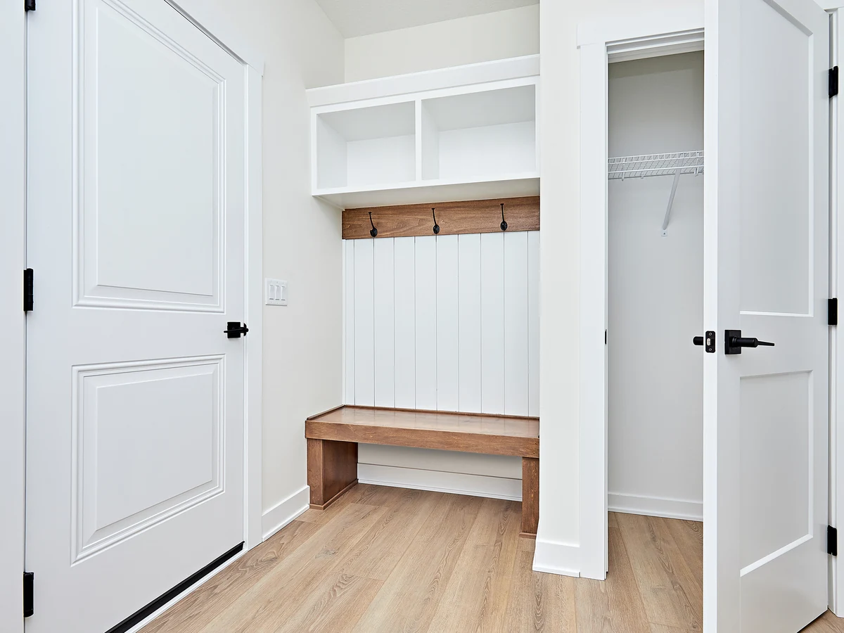 White hallway with mudroom bench freshly painted in Barnstaple by Barnstaple Decorators