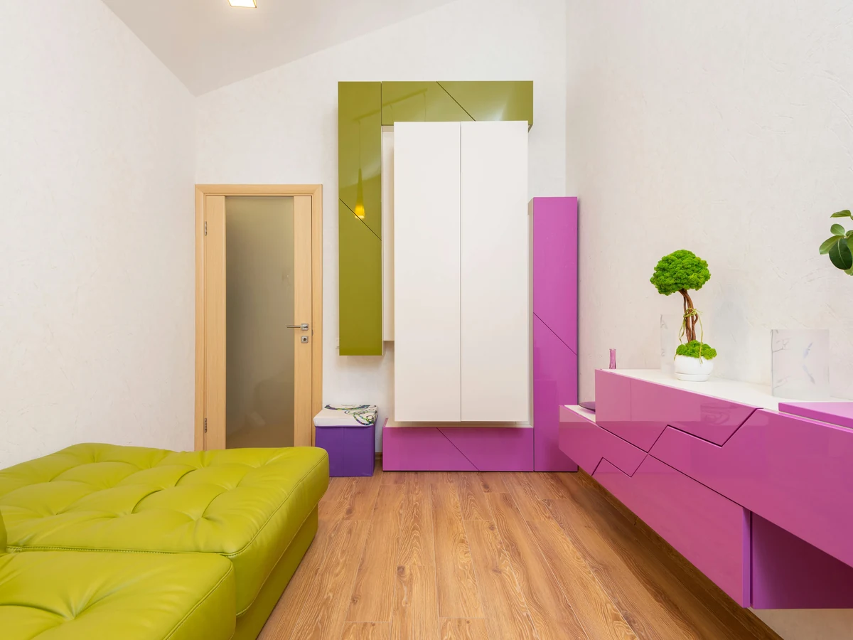 Bright room with green accent wall painted by Barnstaple Decorators