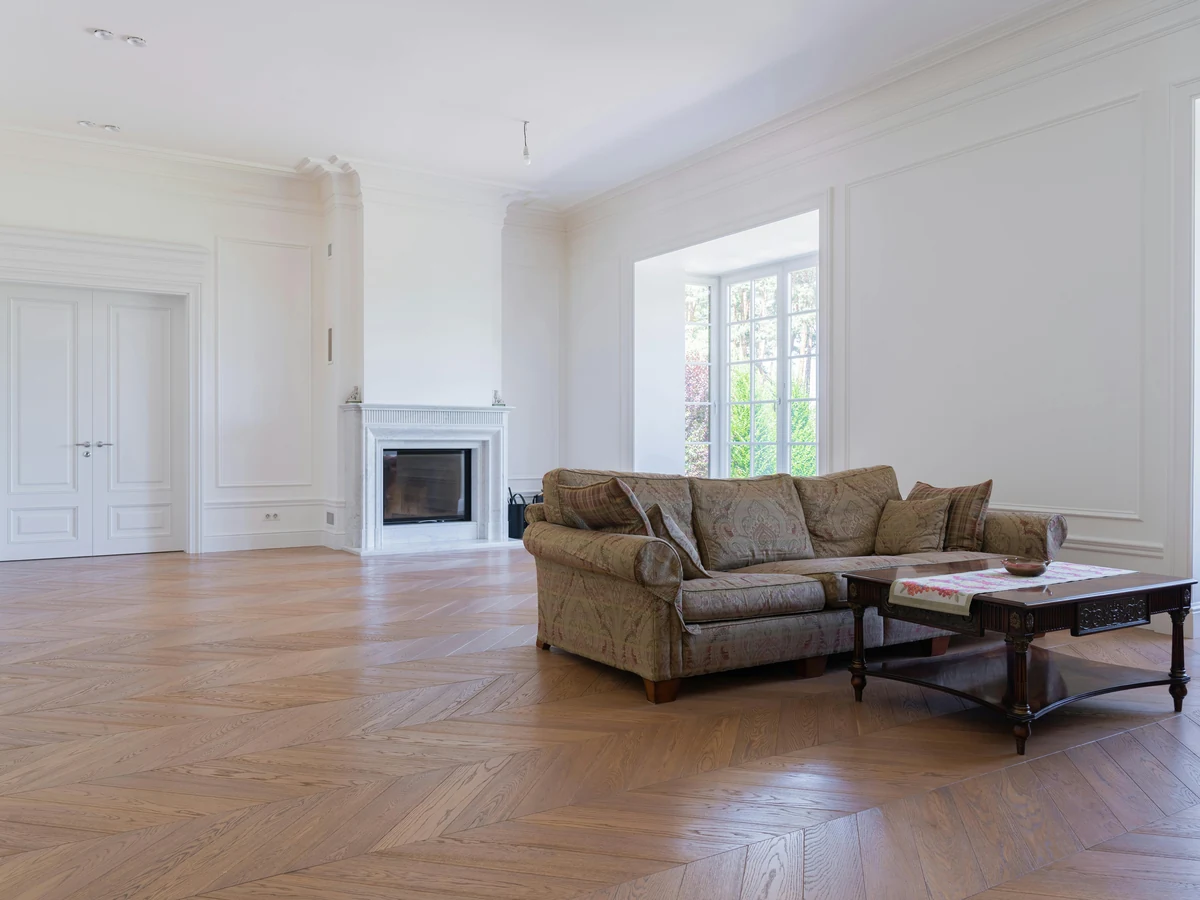 Bright white living room with feature wall treatment in Barnstaple