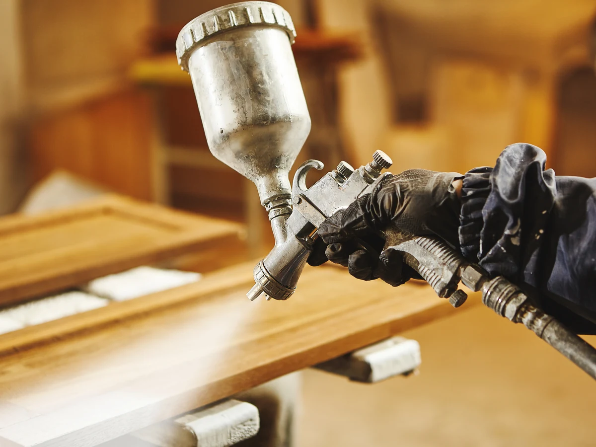 Close-up of decorator's hands working on a decoration project in Barnstaple