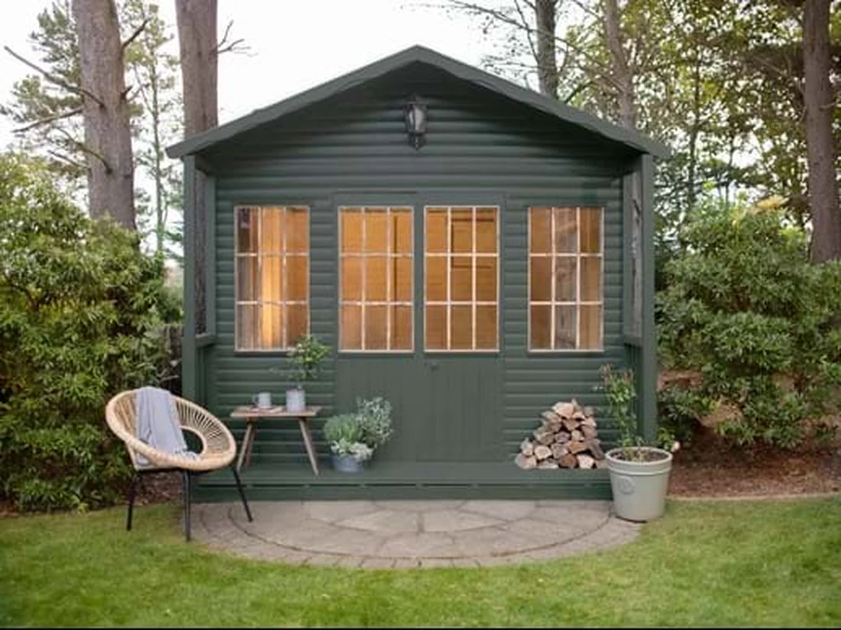Dark green painted garden shed by Barnstaple Decorators in Barnstaple