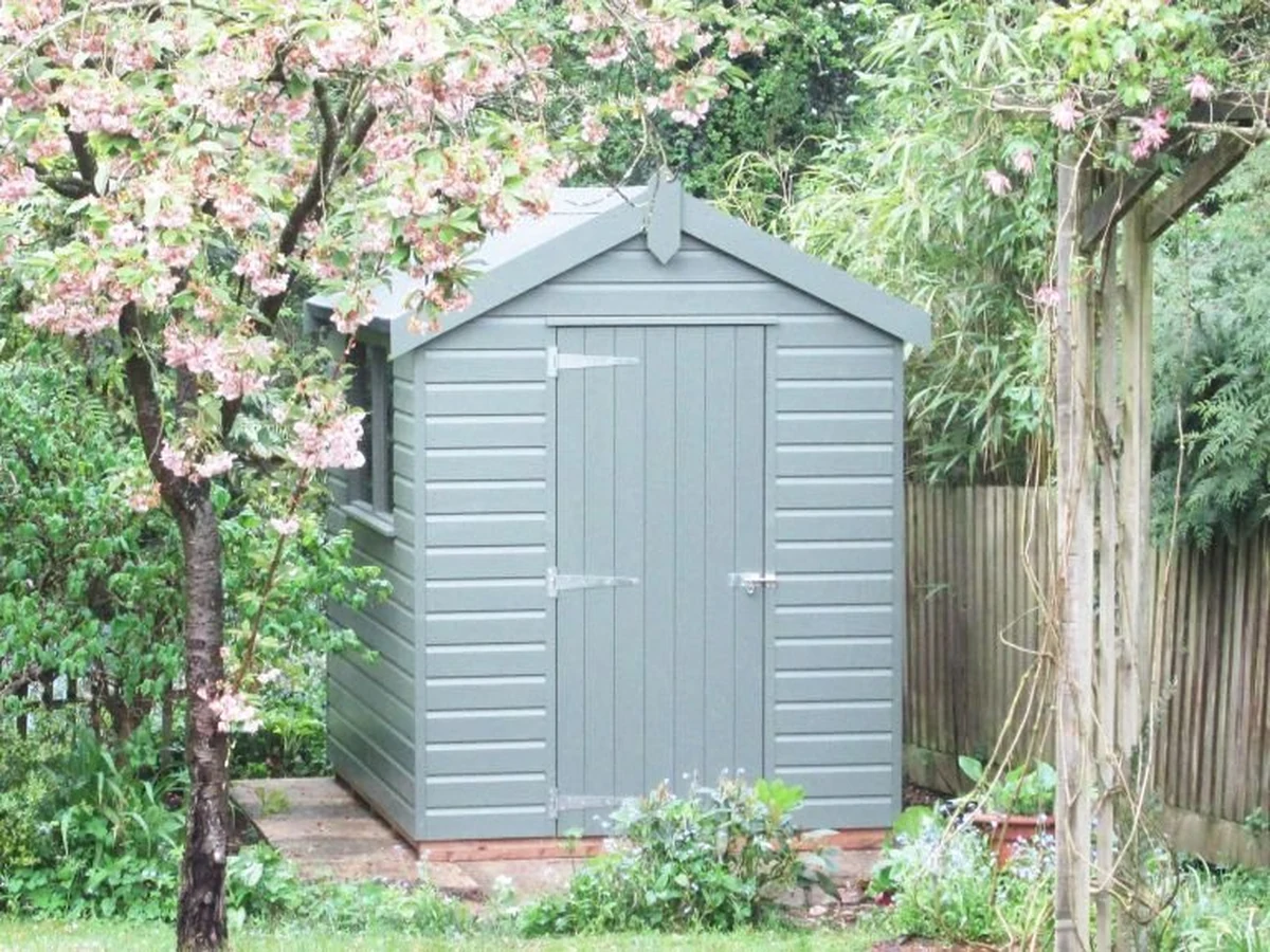 Grey timber garden shed painted by Barnstaple Decorators in North Devon